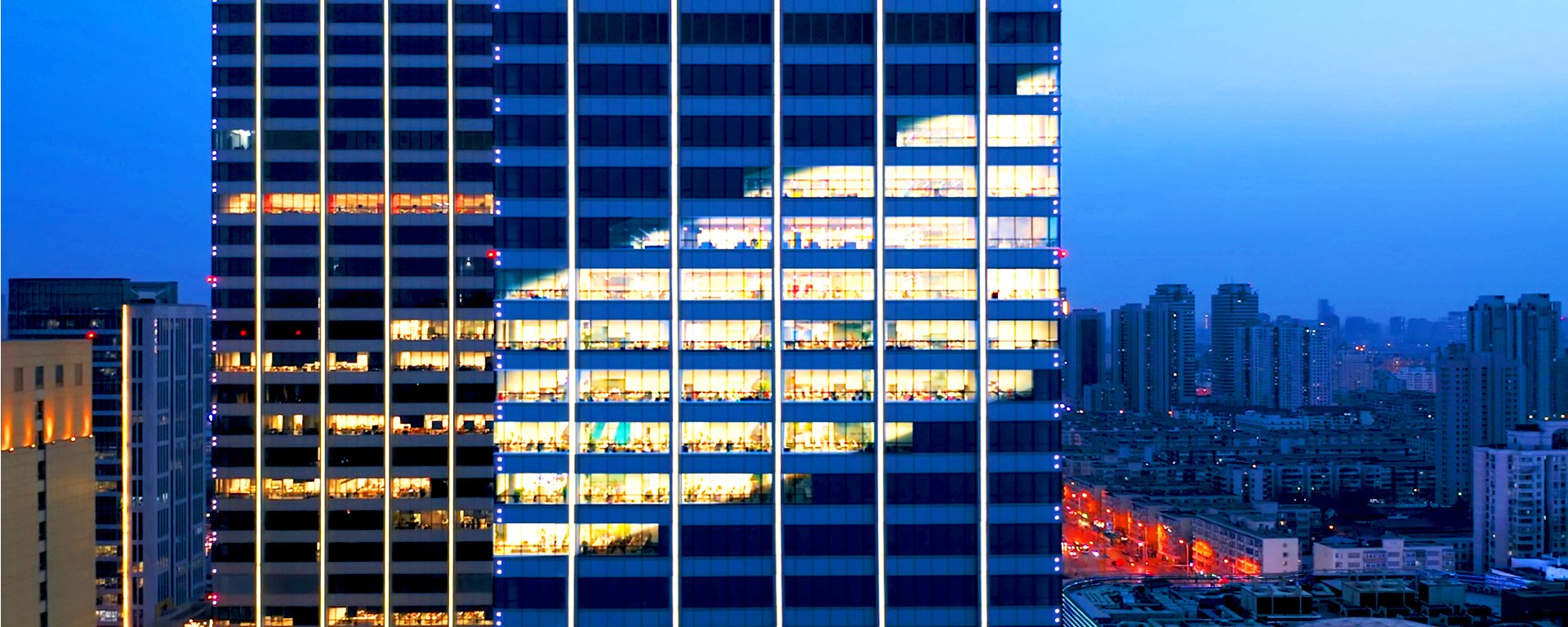 Building with lights in the shape of the SilverPeak Strategic Capital logo.