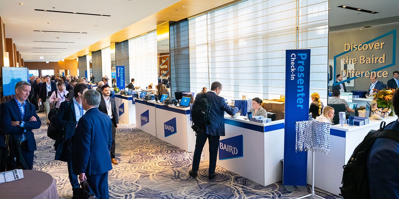 Attendees in the check-in area of a SilverPeak Strategic Capital Conference