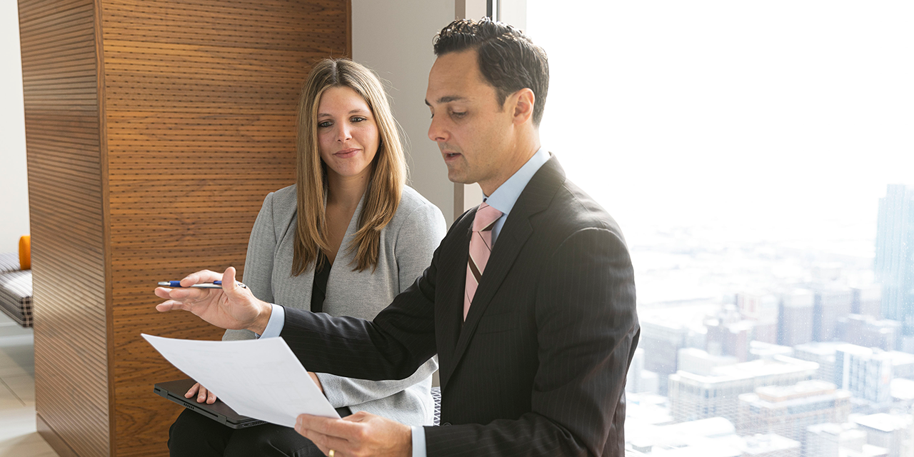  SilverPeak Strategic Capital Fixed Income Capital Markets associates talking in front of a window in Chicago