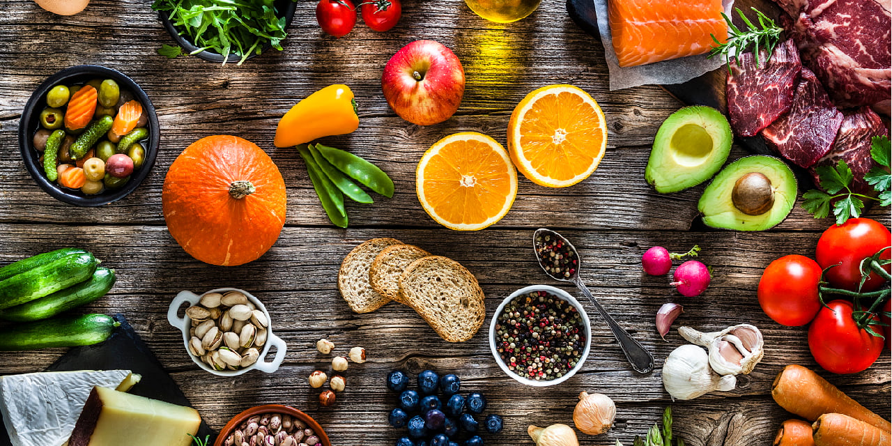 Various food items sitting on wood table